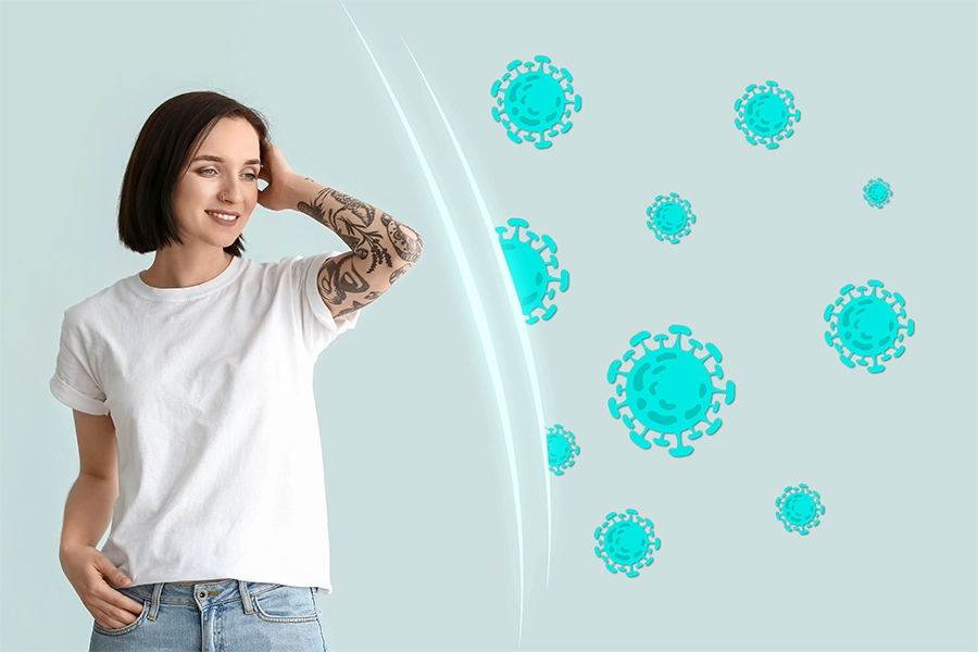 Tattooed young woman shielded by pathogens in air